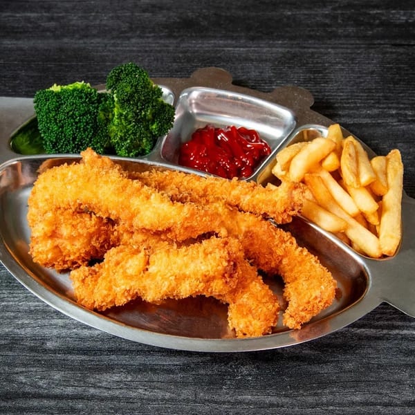Kids' meal with crispy chicken tenders, french fries, ketchup, and broccoli on a metal tray.